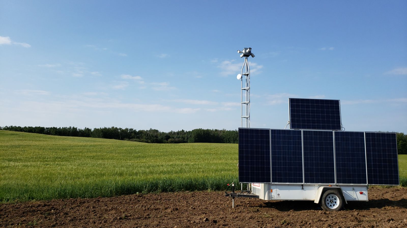 Gatekeeper solar-powered remote video surveillance trailer with camera mast on an Alberta job site